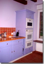 Kitchen showing double oven cooker and microwave