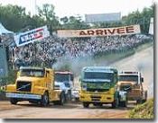 Racing lorry cabs around a Camion Cross circuit