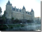 Josselin's Chateau at dawn, mist rising off the canal